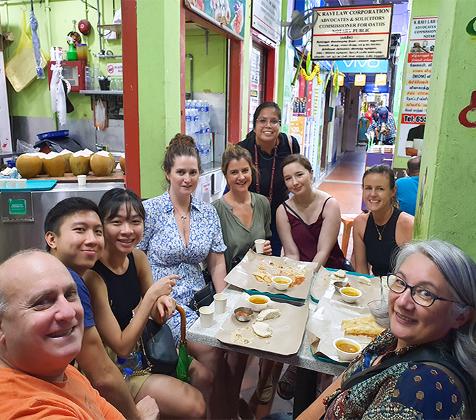 tourists enjoying indian dishes indian food in singapore