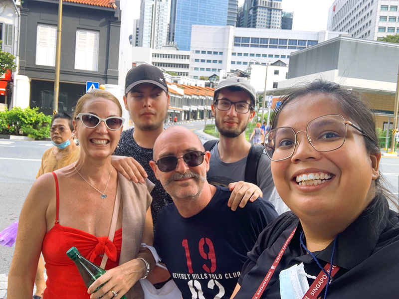 happy guests with local guide on chinatown walking tour